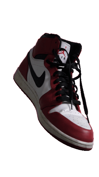 A sneaker turning against a plain background — After